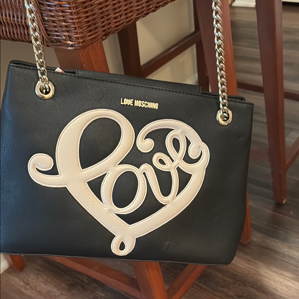 Brand new moschimo bag there is a few scratches on the bag my cat got to it